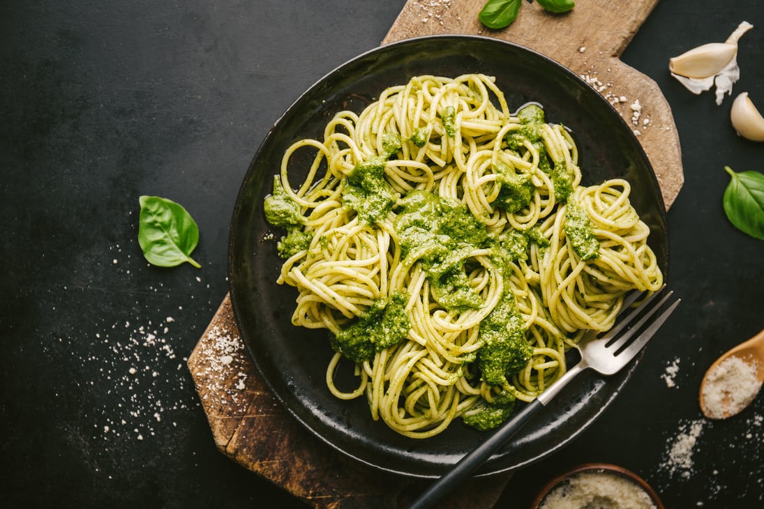 Tasty pasta with pesto served on plate